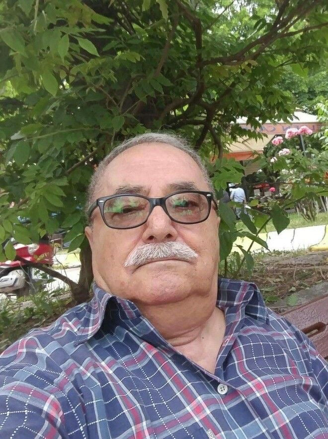 <em>Carlos E.</em>